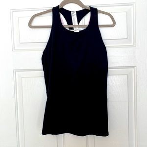 Fabletics fitted tank top with built in bra. Purple strappy back detail.